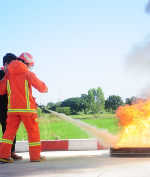 Instructor training how to use a fire extinguisher